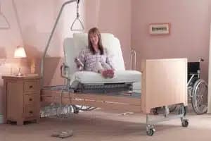 A woman using a turning bed